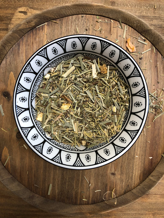 Tulsi Clarity loose-leaf herbal tea with rosemary and Kapoor tulsi in a ceramic bowl